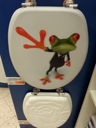 Nothing says "classy bathroom" like a tree frog in a tuxedo...he also walks on two legs